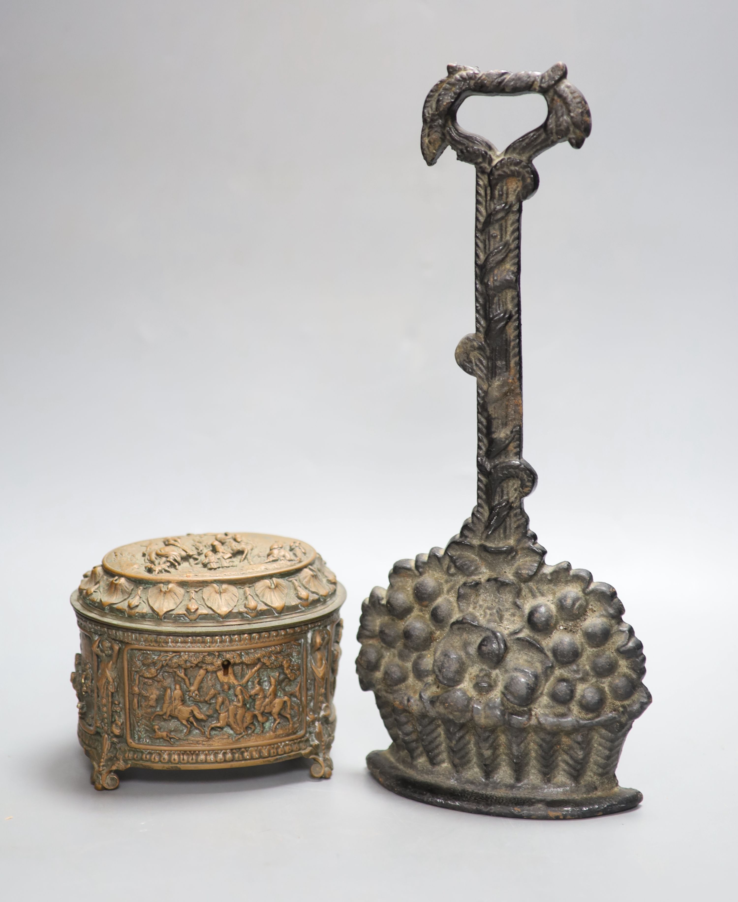 A Victorian black painted cast iron door stop, height 36cm, and a Victorian cast copper lidded casket